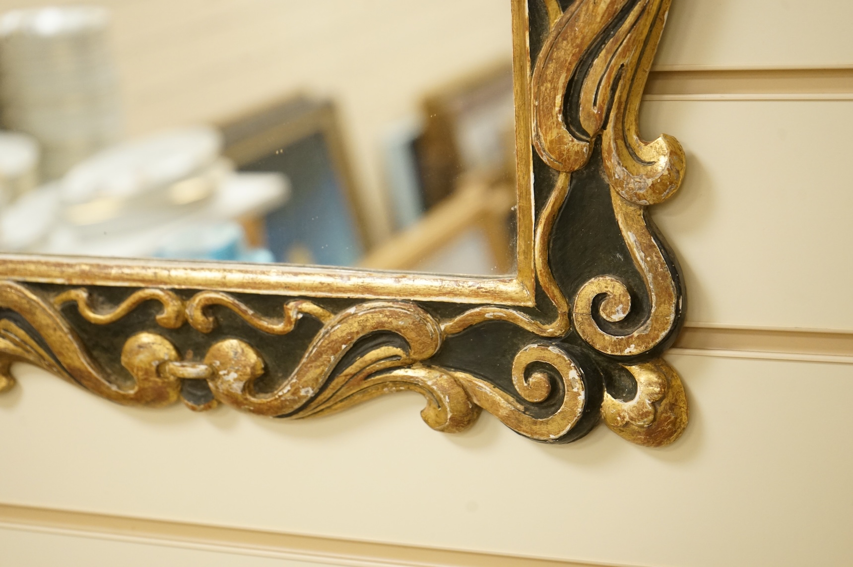 A 19th century parcel-gilt mirror, 53cm high
